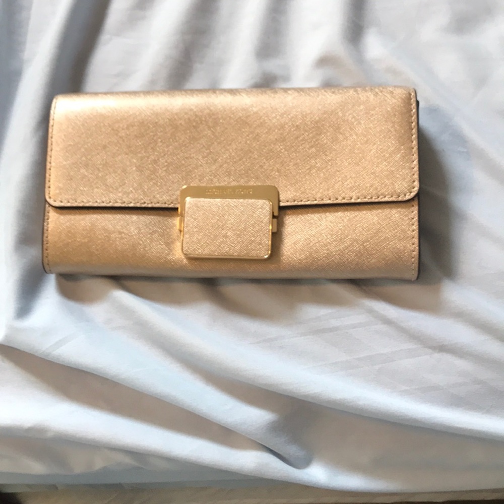 Gold Michael kors purse/clutch